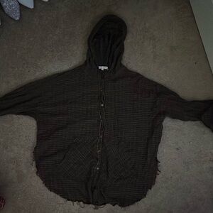 This is a brown plaid and frayed cover shirt. Brand gilded intent size large.